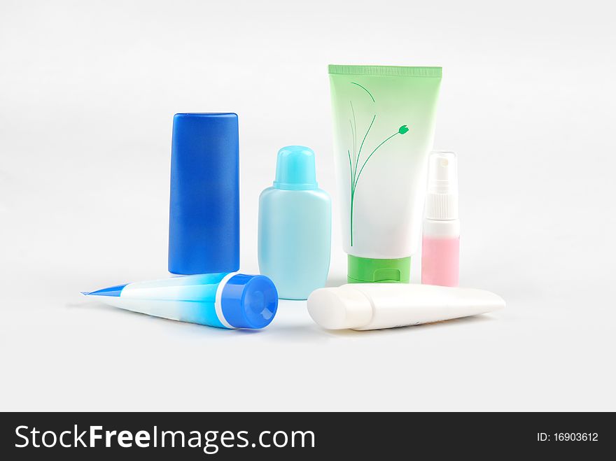 Different cosmetic bottles and tubes isolated on white background . Each object on different layer.