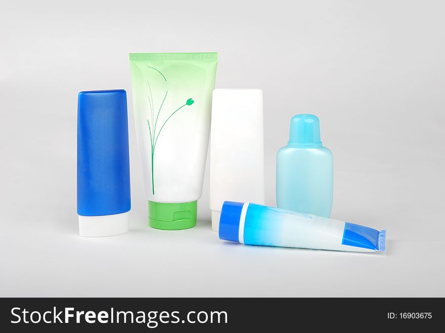 Different cosmetic bottles and tubes isolated on white background . Each object on different layer.