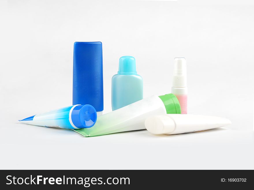 Different  cosmetic   bottles and tubes  isolated on white background . Each object on different layer.