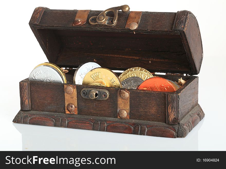Old treasure chest with hanukkah money isolated on white background