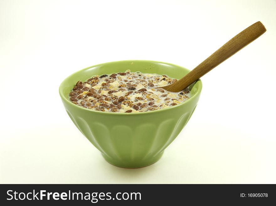 Muesli in a green bowl isolated on a white background. Muesli in a green bowl isolated on a white background