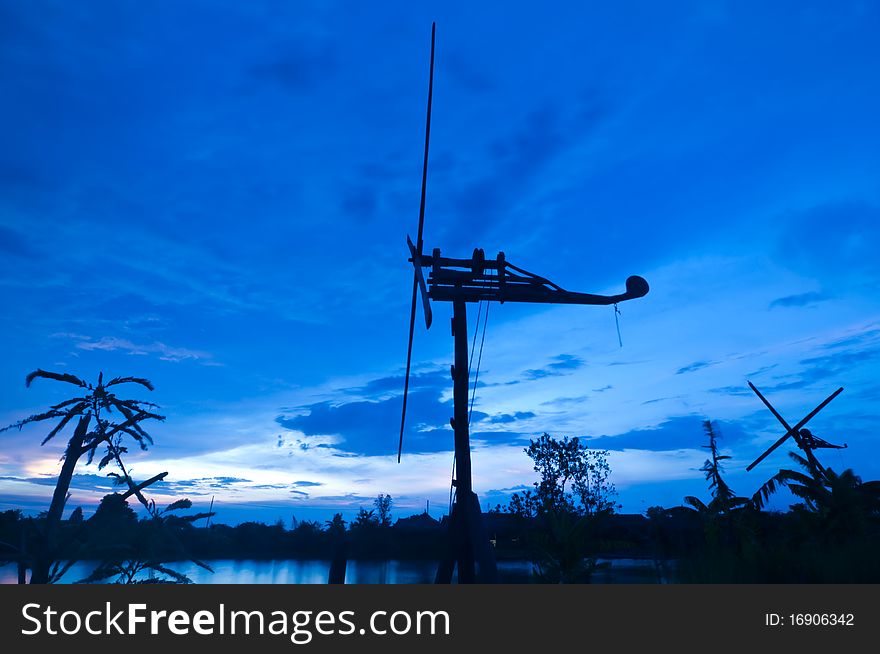 Windmill and sky in evening, Thailand.