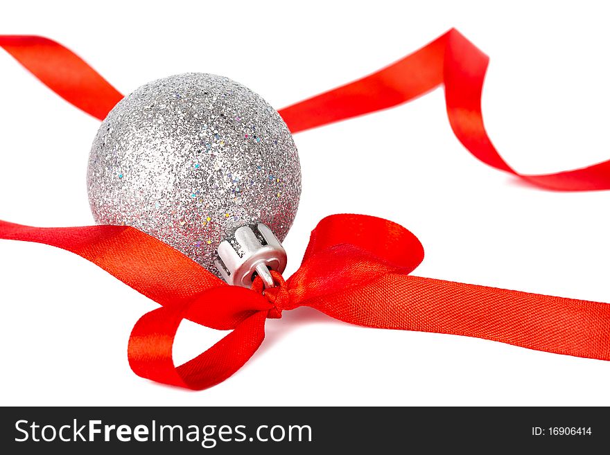 Christmas silver ball with red ribbon isolated on white