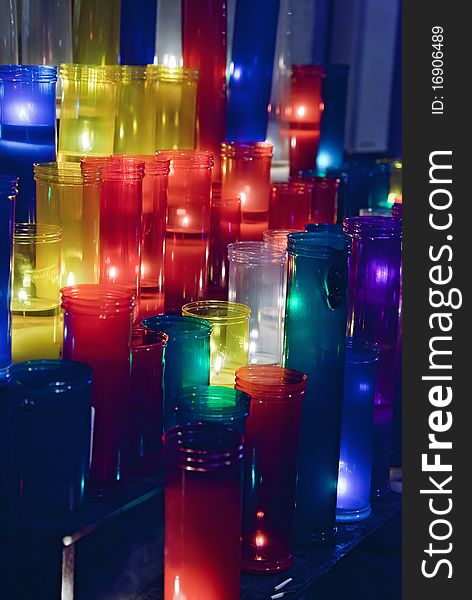 Colored votive candles in church