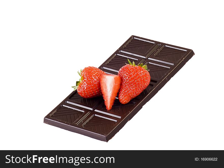 Dark chocolate and strawberries over white background