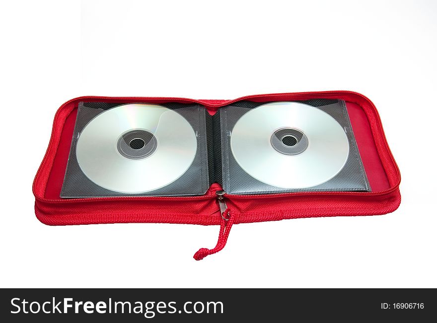 Two disks in a red cover on a white. Two disks in a red cover on a white