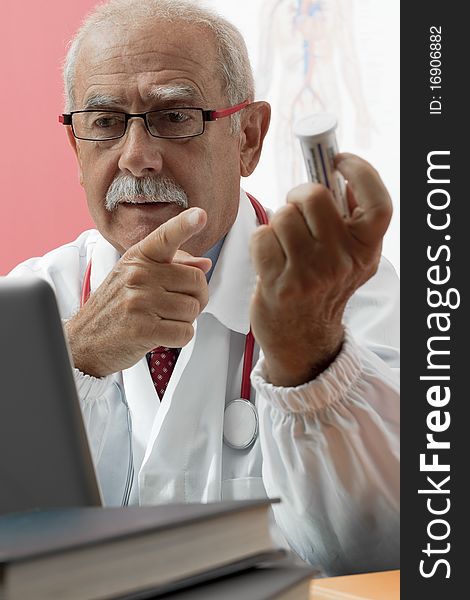 Senior Doctor Using Webcam