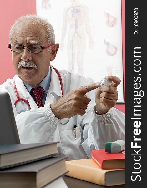 Senior Doctor Using Webcam