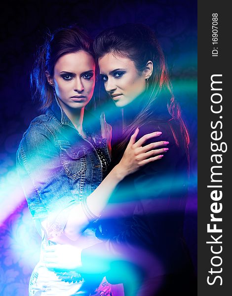 Female twins, studio shooting with light painting. Female twins, studio shooting with light painting.