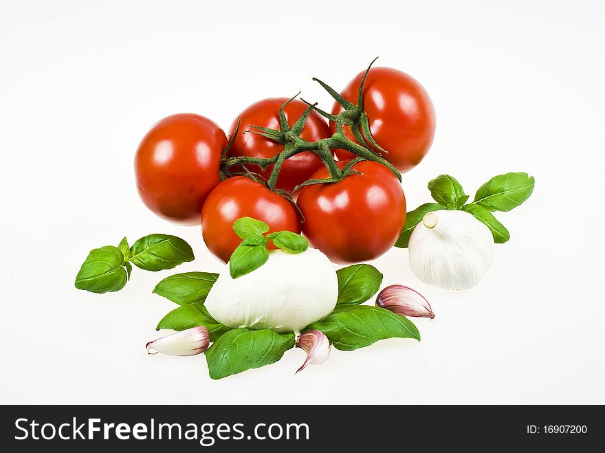 Bunch of tomatoes with mozzarella, garlic and basil. Bunch of tomatoes with mozzarella, garlic and basil