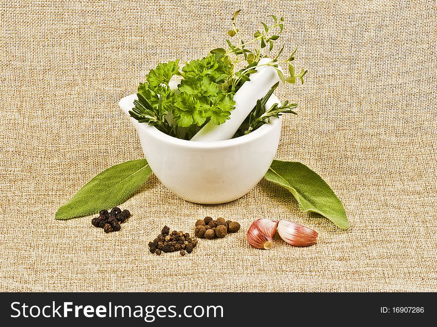 Ceramic pestle of thym, parsley, and rosemary. Ceramic pestle of thym, parsley, and rosemary