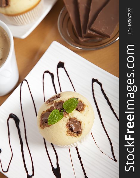 Delicious Chocolate Muffin On A Decorated Plate