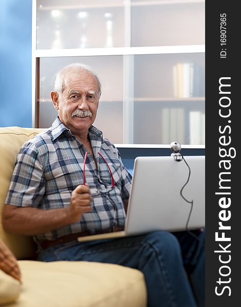 Senior man/Grandfther speaking through webcam