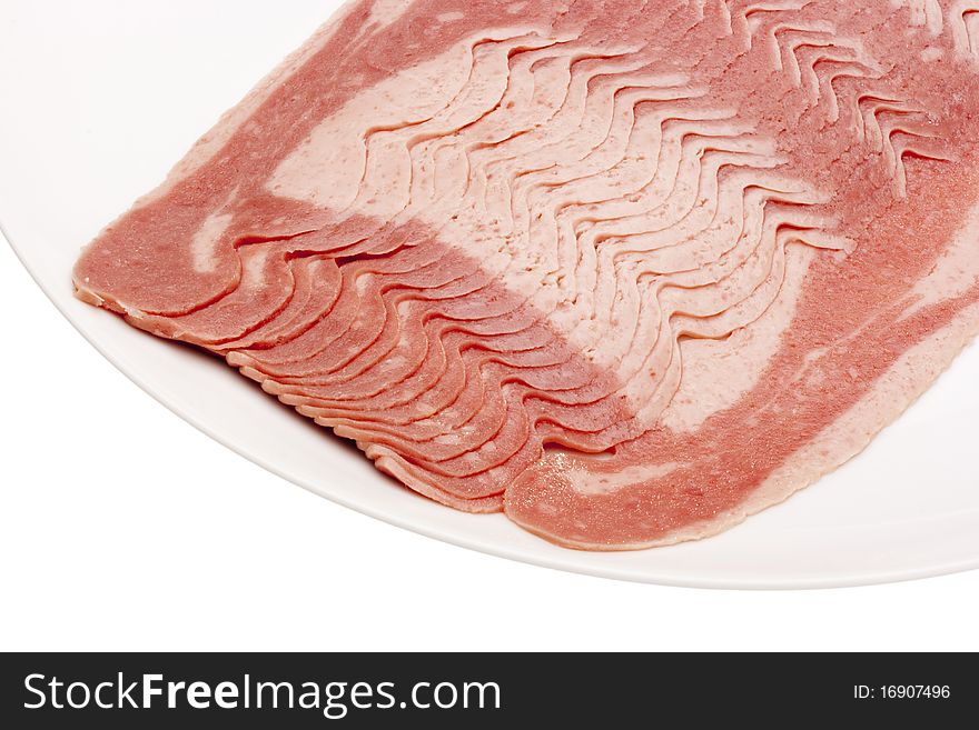 Raw bacon, cut thin slices, without packaging.