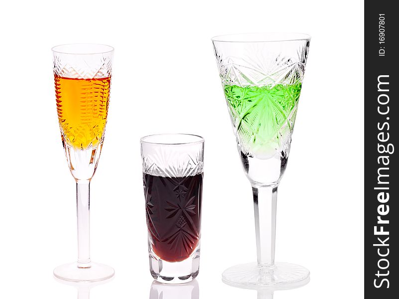 Three glasses with different drinks isolated on white background