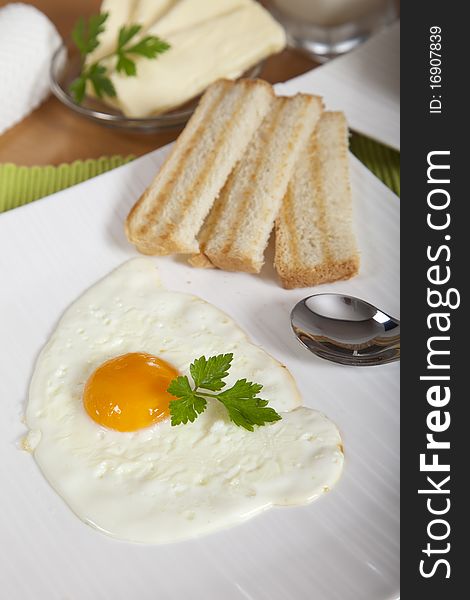 Delicious sunny side egg with roasted toast for breakfast