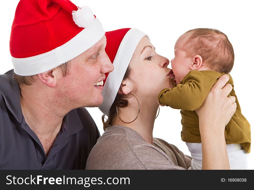 Young happy family with a baby girl getting ready for chirstmas. Young happy family with a baby girl getting ready for chirstmas.