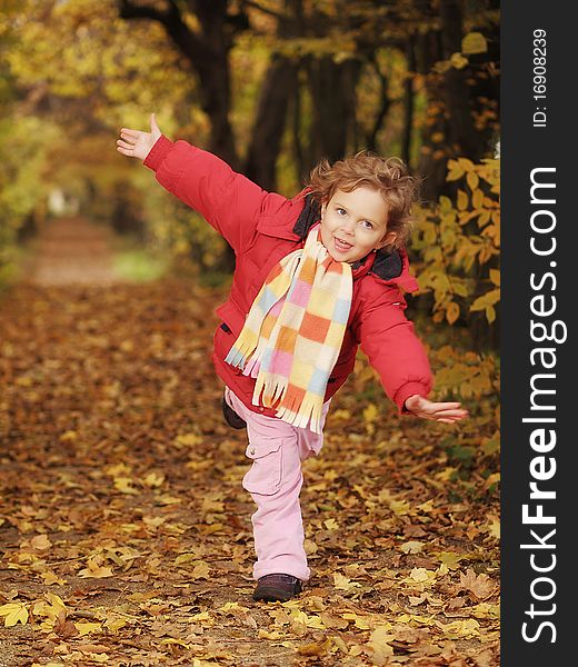 Little girl with scarf during autumn