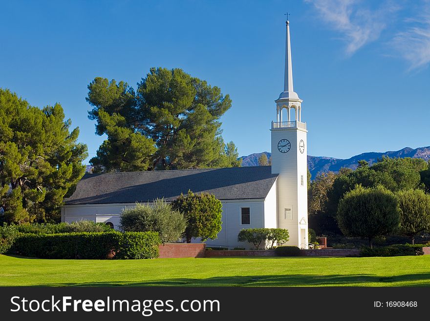 Church set in pastoral setting with mountain background. Church set in pastoral setting with mountain background.