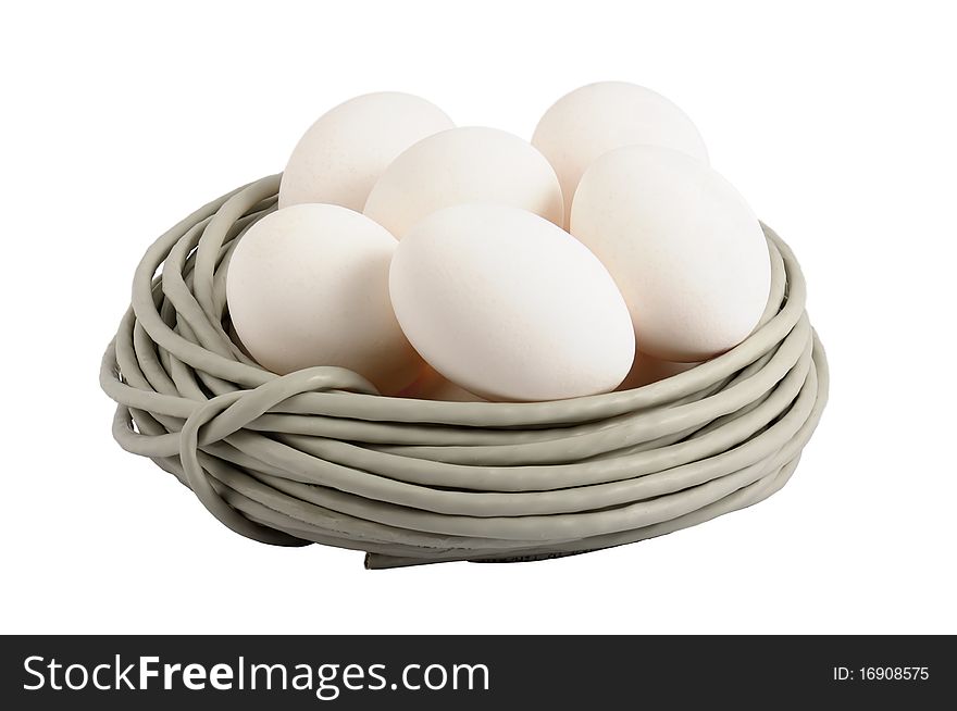 Eggs lay in a nest made of a cable. Symbolizes a birth of new technologies. Closeup. Isolated on the white. On eggs it is possible to write the name of new technologies, for example ISDN, FTTB, GPON. Eggs lay in a nest made of a cable. Symbolizes a birth of new technologies. Closeup. Isolated on the white. On eggs it is possible to write the name of new technologies, for example ISDN, FTTB, GPON