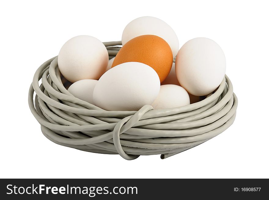 Eggs lay in a nest made of a cable. Symbolizes a birth of new technologies. Closeup. Isolated on the white. On eggs it is possible to write the name of new technologies, for example ISDN, FTTB, GPON. Eggs lay in a nest made of a cable. Symbolizes a birth of new technologies. Closeup. Isolated on the white. On eggs it is possible to write the name of new technologies, for example ISDN, FTTB, GPON