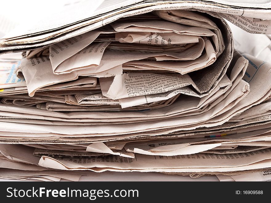 Stack newspapers on white background