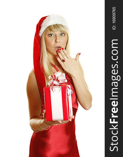 Beautiful girl in a red dress and hat of Santa with a big gift box. Expressed surprise, his hand covers his mouth open. Lots of copyspace and room for text on this isolate. Beautiful girl in a red dress and hat of Santa with a big gift box. Expressed surprise, his hand covers his mouth open. Lots of copyspace and room for text on this isolate