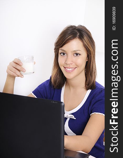 Young woman in breakfast, drinking and using laptop. Young woman in breakfast, drinking and using laptop