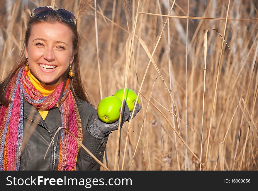 Beautiful Young Woman With Green Apples