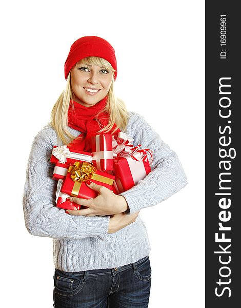 Young beautiful woman in a blue knitted sweater, red hat and red scarf hold many different sizes Christmas gift boxes. Young beautiful woman in a blue knitted sweater, red hat and red scarf hold many different sizes Christmas gift boxes.