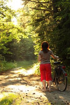 Bicyclist Woman Walk In The Park With Bikes Royalty Free Stock Images Bicyclist Woman Walk In The Park With Bikes Royalty Free Stock Images