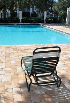 Chair In Front Of A Swimming Pool Royalty Free Stock Photography