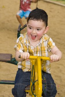 Cute Boy On A Carousel Royalty Free Stock Images