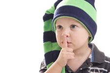 Child In A Green Cap On A White Background Royalty Free Stock Photos