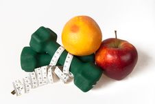 Dumbells Wrapped In Measure Tape With Fruits Stock Images Dumbells Wrapped In Measure Tape With Fruits Stock Images