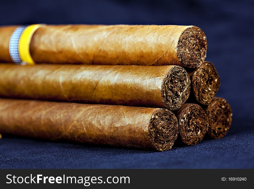 Cuban top cigars on dark background