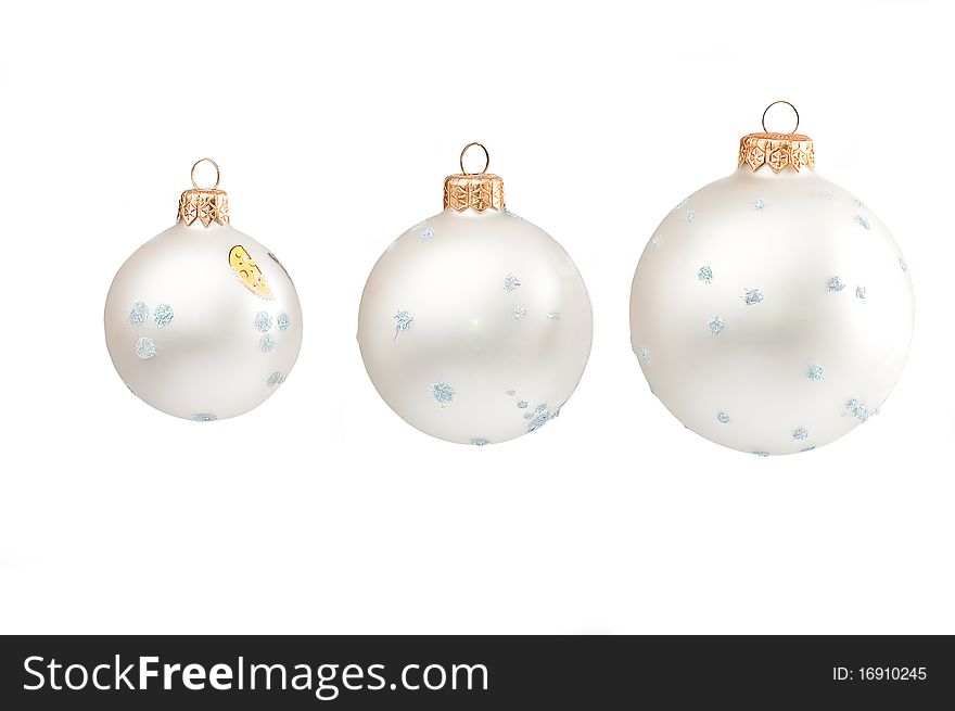 Snow Christmas spheres on a white background close up