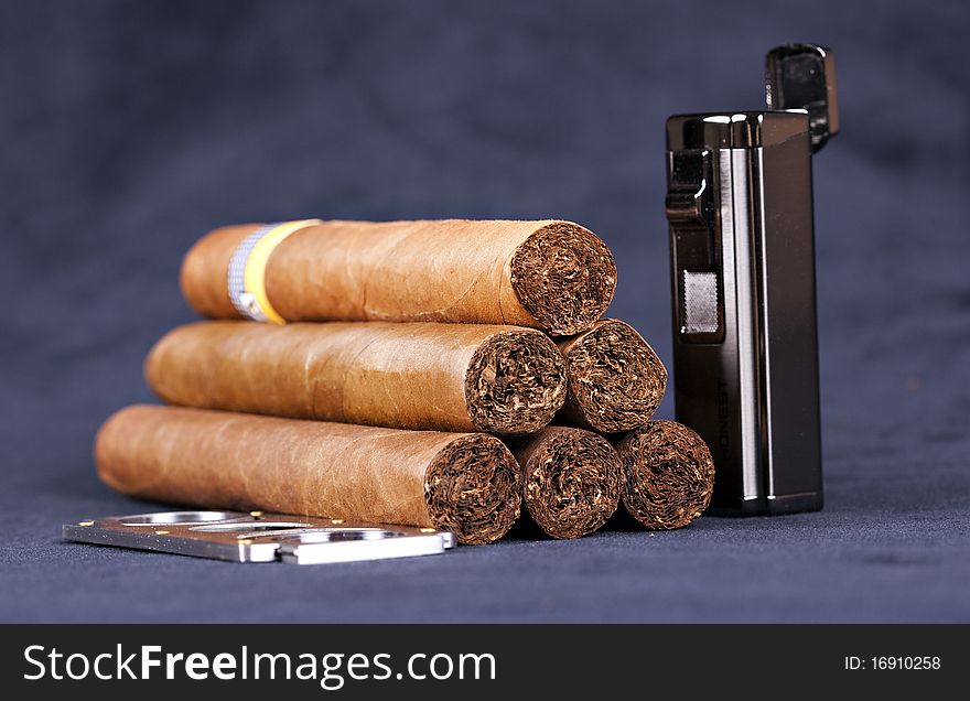 Cuban top cigars with lighter and cutter