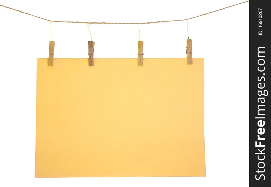 Orange blank paper sheet on a clothes line. Isolated on white background. Orange blank paper sheet on a clothes line. Isolated on white background.