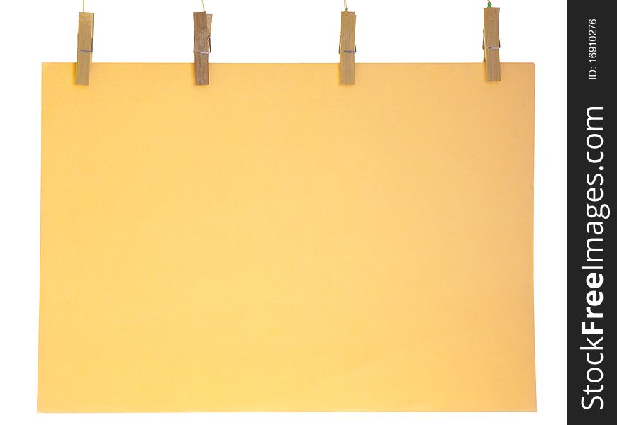 Orange blank paper sheet on a clothes line. Isolated on white background. Orange blank paper sheet on a clothes line. Isolated on white background.