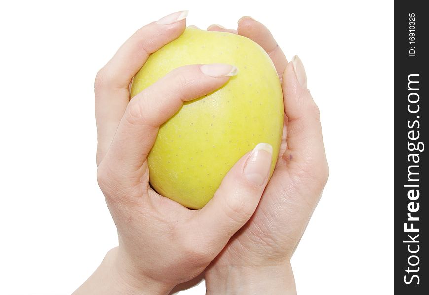 Apple in female hands close up