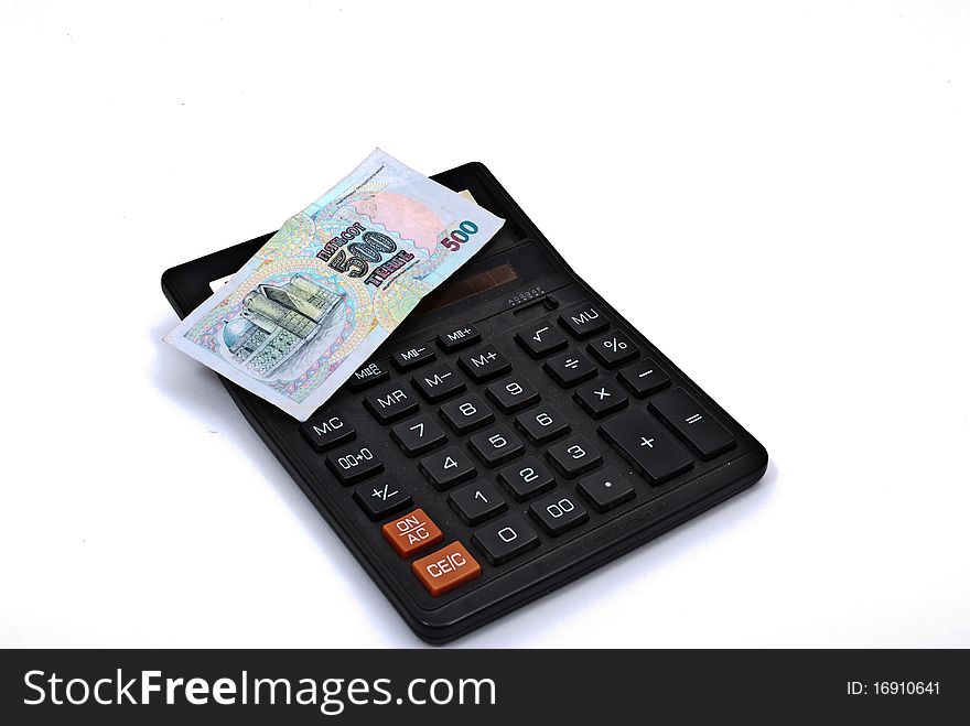 Calculator and currency on white background