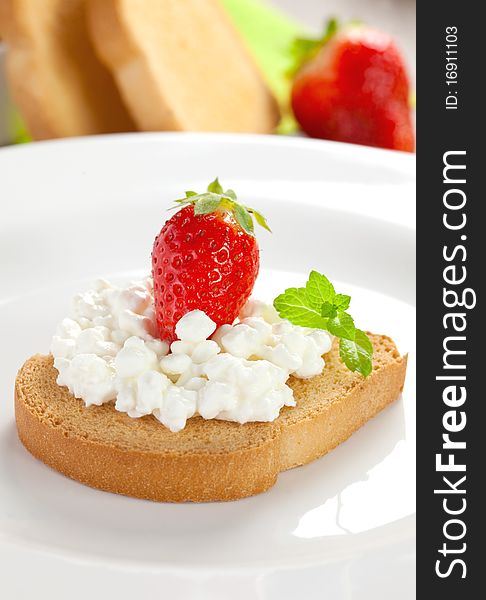 Rusk with cottage cheese and strawberry. Rusk with cottage cheese and strawberry