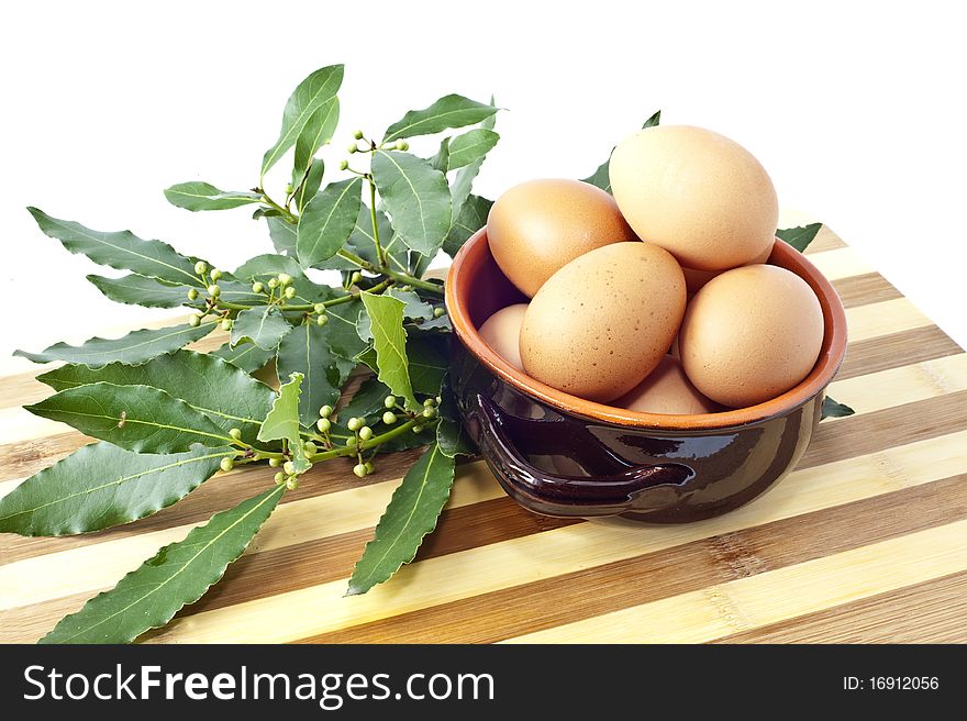 Eggs into a bowl of coconut on white background. Eggs into a bowl of coconut on white background