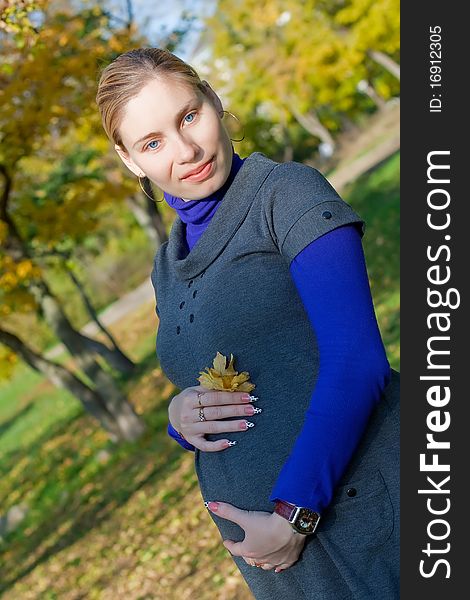 Beautiful pregnant woman in the park. Beautiful pregnant woman in the park