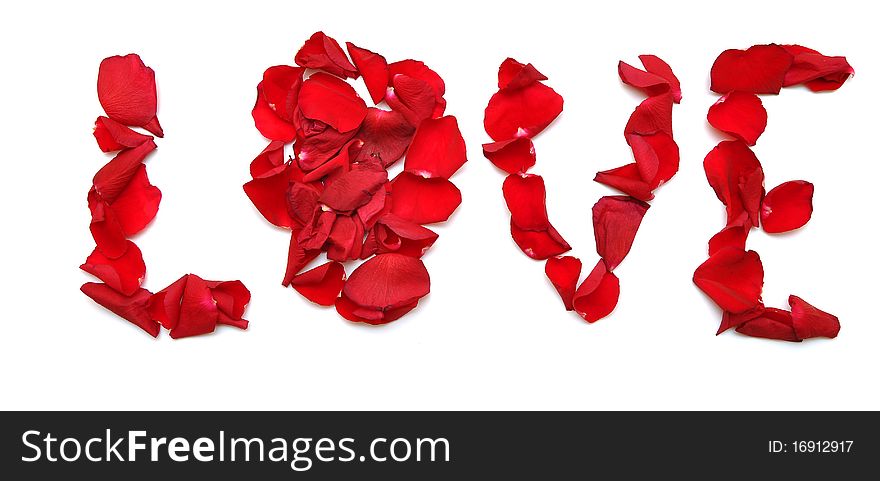 Word LOVE made of petal red rose on white