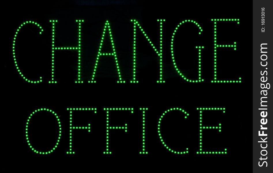 Green light, neon, currency exchange, signage. Green light, neon, currency exchange, signage