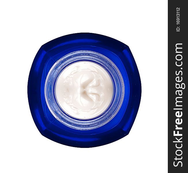 Tub with a face cream with a blue cover on a white background