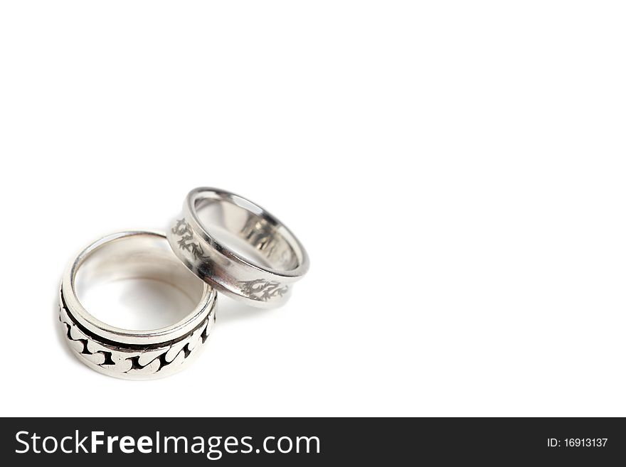 Silver and steel rings with a free space on bottom left. Silver and steel rings with a free space on bottom left