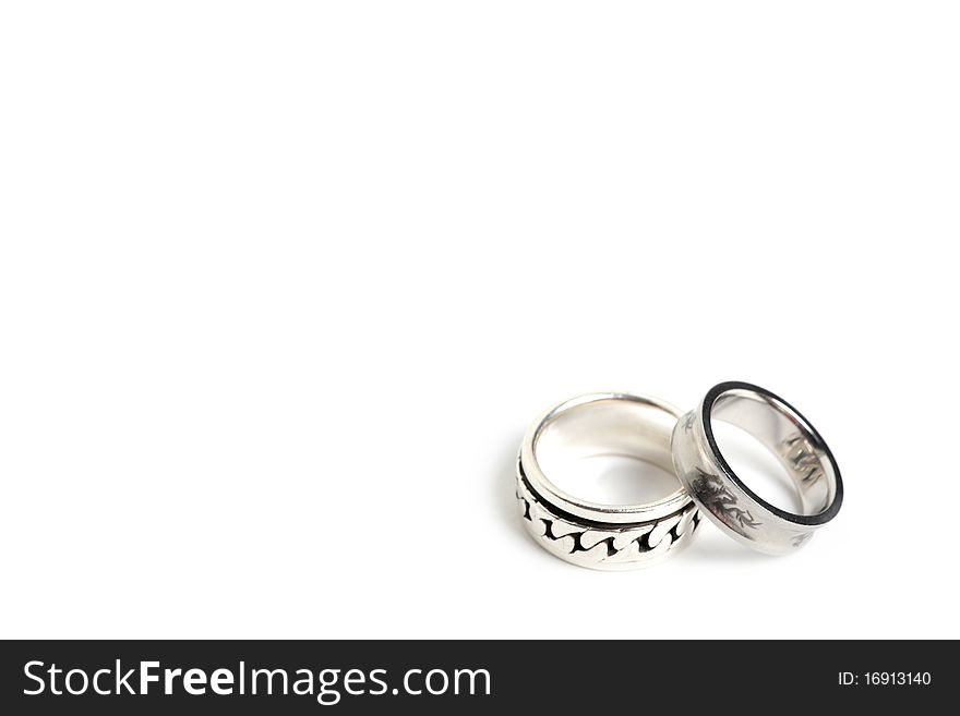 Silver and steel rings with a free space on bottom right. Silver and steel rings with a free space on bottom right